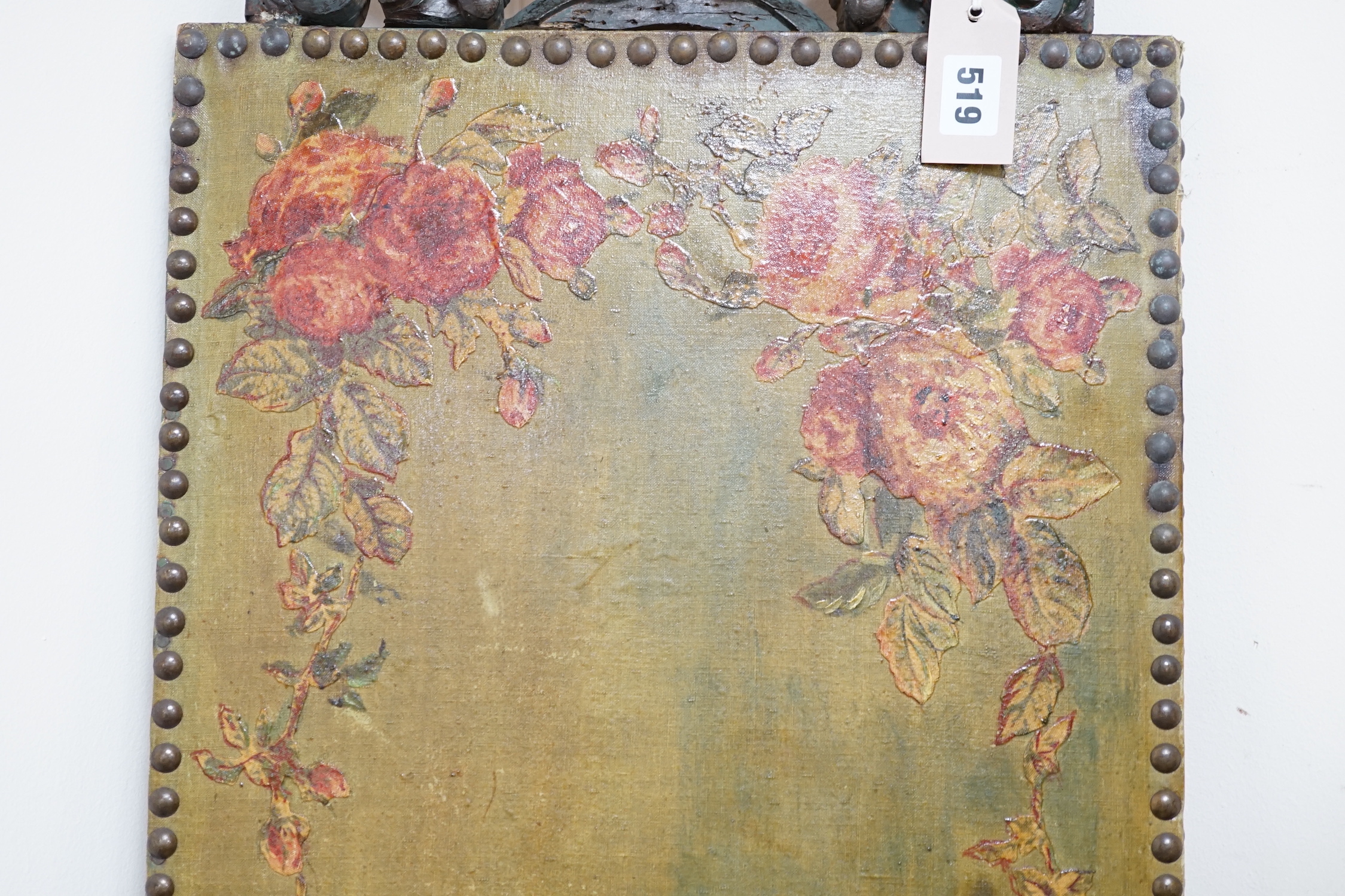 A 19th decoupage canvas panel with studded edges and carved figural mount, 107cm high